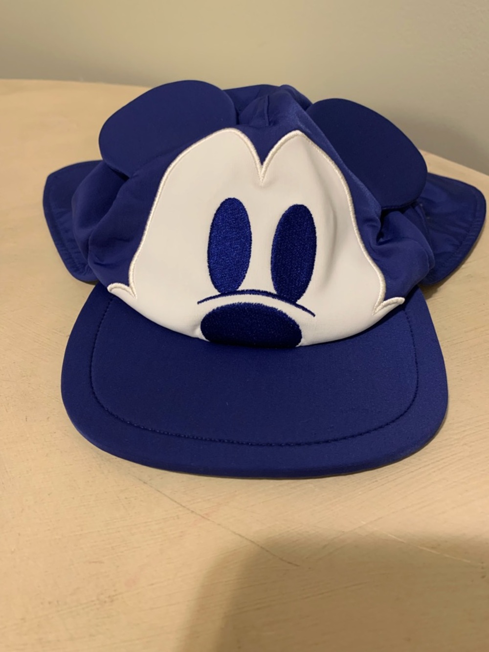 Disney Baby Mickey Mouse hat featuring a neck sun shield designed for infants.